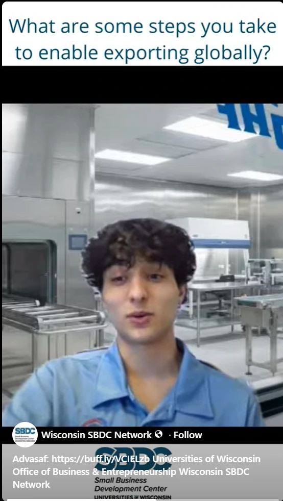 A team member from Advasaf LLC, wearing a blue uniform shirt, speaks on camera inside a clean medical-grade manufacturing facility in Brookfield, Wisconsin. The video thumbnail features the question "What are some steps you take to enable exporting globally?" overlaid on the image, along with the Wisconsin SBDC (Small Business Development Center – Universities of Wisconsin) logo. This short-form video, published on the SBDC's official YouTube channel under the title "EU product," highlights Advasaf's international export readiness strategy and the practical steps taken to enter global markets for regulated medical device products.