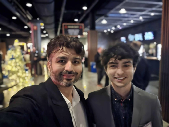 Advasaf LLC founder Kashyap poses for a photo with a colleague at a professional business networking event. Both are dressed in business attire and smiling, with a lively event venue visible in the background. This image represents the entrepreneurial spirit and professional community engagement that has been central to Advasaf's growth journey — supported by strategic guidance from Ron Chisholm and the Wisconsin Small Business Development Center (SBDC) at UW-Whitewater, which provided critical assistance in business planning, funding pathways, supplier diversity programs, and minority-owned business registration.